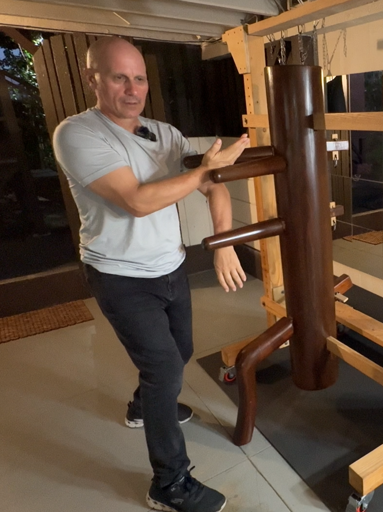 Sifu Brandon demonstrating Quan Sau on the wooden dummy
